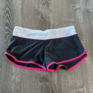 Black and hot pink Lululemon Speed Shorts